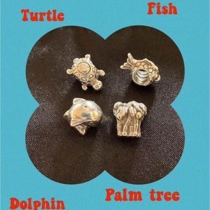 Four authentic Pandora charms.